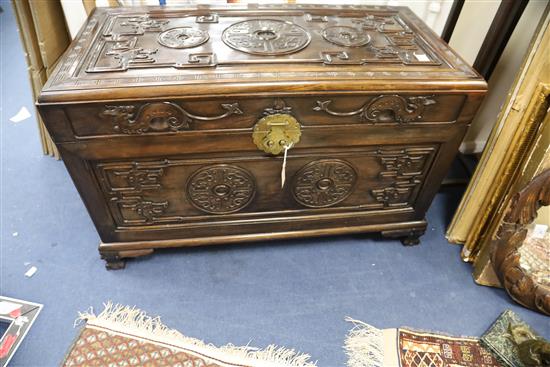 A Chinese hongmu archaistic chilong and medallion chest, c.1900, H. 63.5cm x W. 106cm x D. 54cm
